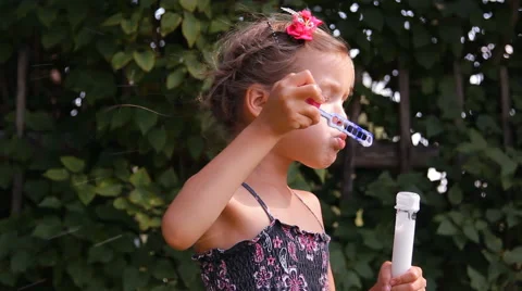 Girl blows bubbles Video stock 45329200