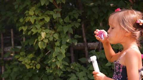 Girl blows bubbles Video stock 45329273