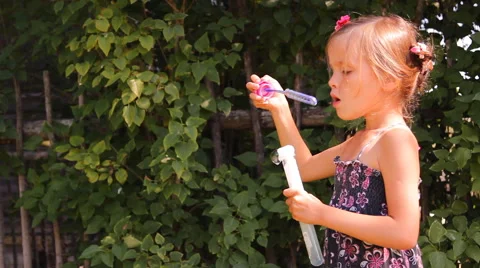 Girl blows bubbles Video stock 45329456