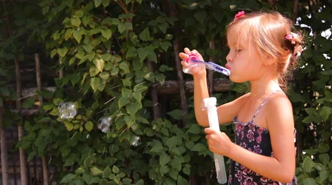 Girl blows bubbles Video stock 45329561