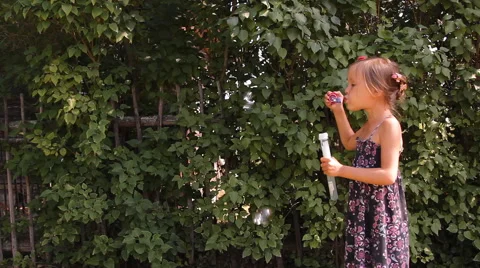 Girl blows bubbles Video stock 45329655