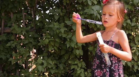 Girl blows bubbles Video stock 45330117