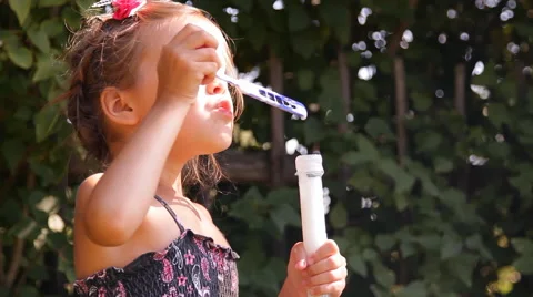 Girl blows bubbles Video stock 45330449
