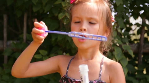 Girl blows bubbles Video stock 45343852