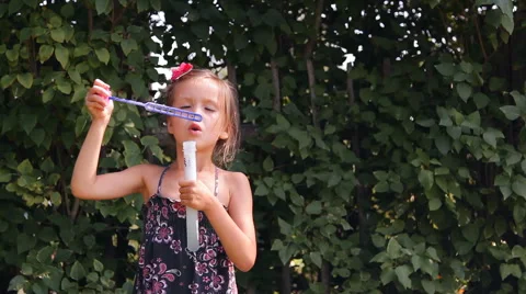 Girl blows bubbles Video stock 45344183