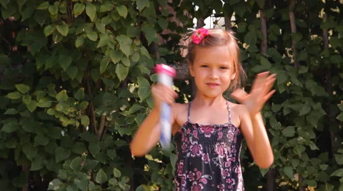 Girl blows bubbles Video stock 45375171