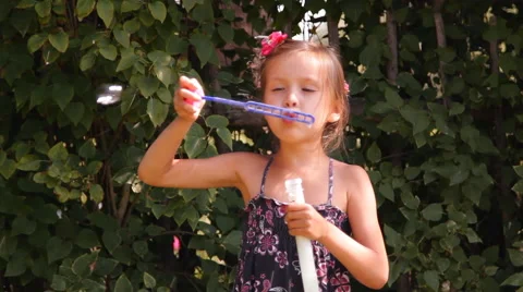 Girl blows bubbles Video stock 45375280