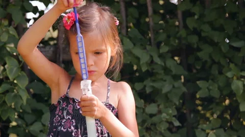 Girl blows bubbles Video stock 45375610