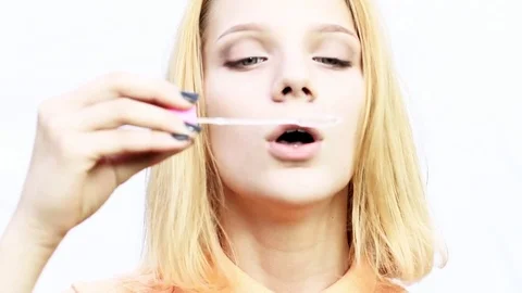 A girl blows bubbles Stock Footage 78615399