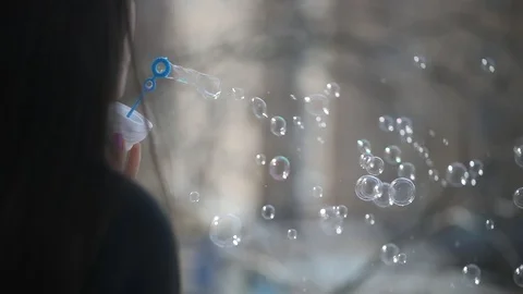 Girl blows bubbles Stock Footage 106291376
