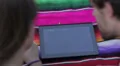 girl with boy touches a tablet to browse photos HD Footage