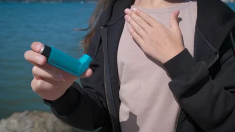 Girl with breathing problems on beach. Stock Footage 253749106