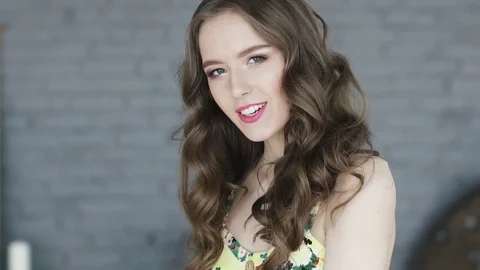 Girl with bright appearance, looking at camera and smiling. portrait of Stock Footage 74866468