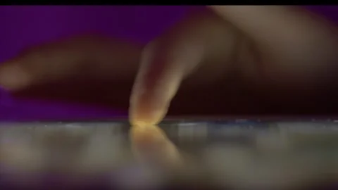 Girl Browsing Digital Tablet Computer With Finger at Night. Stock Footage 294973890