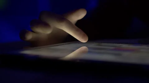Girl Browsing Digital Tablet Computer With Finger at Night. Person Using Sm.. Video stock 302669881