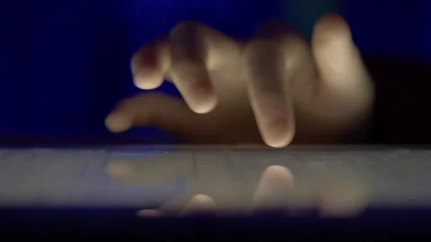 Girl Browsing Digital Tablet Computer With Finger at Night. Person Using Sm.. Stock Footage 311416062