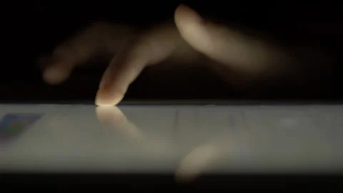 Girl Browsing Digital Tablet Computer With Finger at Night. Person Using Sm.. Stock Footage 329450419