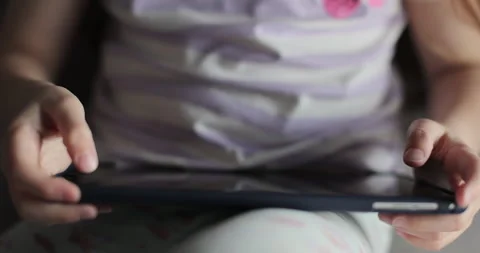 Girl browsing digital tablet computer. Close-up finger scrolling social media. Stock-Footage 335643862