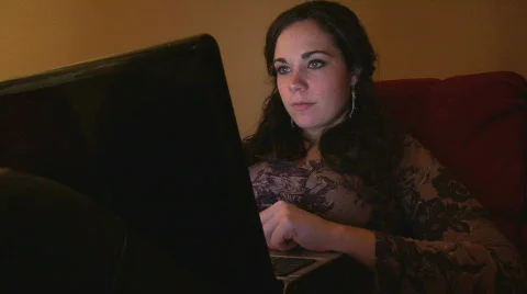 Girl browsing Internet on Laptop Stock Footage