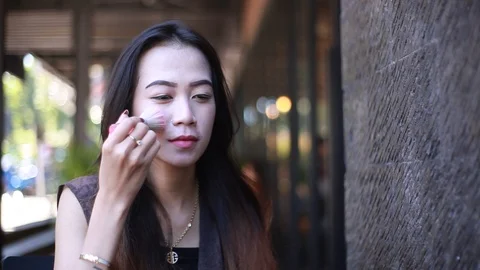 Girl Brushing Cheek Stock Footage 107406726