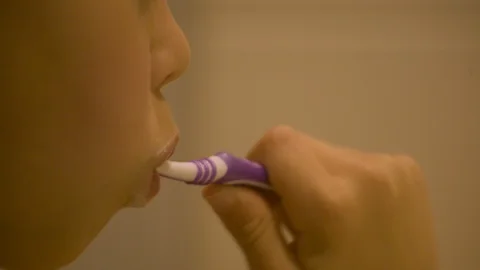 GIRL BRUSHING TEETH Stock Footage 89781269