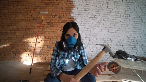 Girl Builder with hammer. Stock Footage 89709798