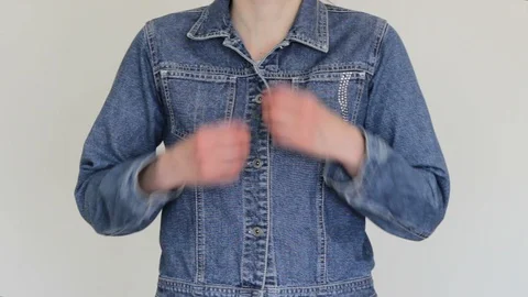 Girl Buttoning The Buttons On Jeans Jacket Stock Footage 129624296