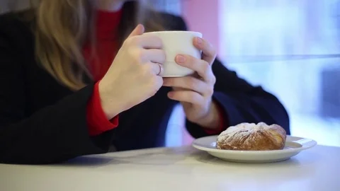 The girl in the cafe drinking tea Stock Footage 70282916