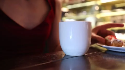Girl in a cafe eats a cake, close-up Stock Footage 134913180