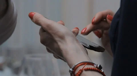 Girl in the Cafe with an iPhone Stock Footage 64263381