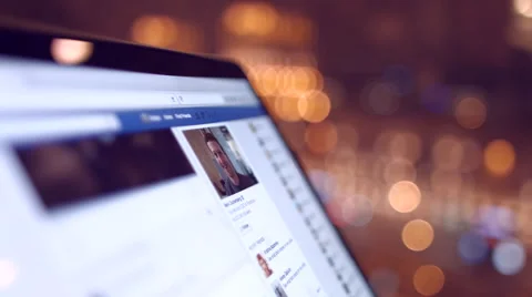 The girl in the cafe looks a Facebook page.  Video stock 59378974