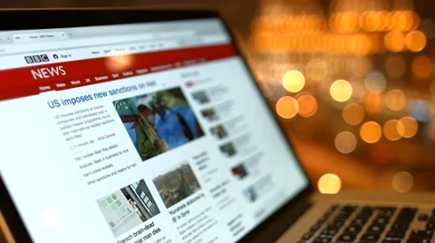 The girl in the cafe reading news bbc on a laptop. Stock Footage 59331922