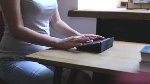 Girl in cafe uses a tablet computer- Stock Footage 54955966