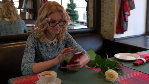 Girl in cafe working with the tablet Stock Footage 71964214