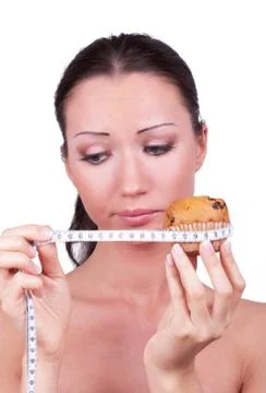 Girl with cake rounded measuring tape Stock Photos