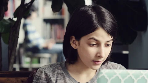 Girl calling her sister and showing the laptop Stock Footage
