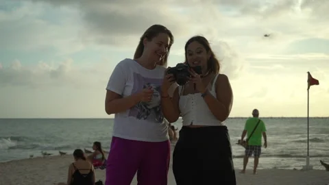 Girl with camera and model giving a high five each other, after photo shooting Stock Footage 167244553