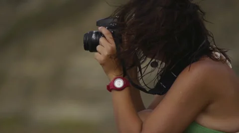 Girl with camera on the beach Stock Footage 64209062