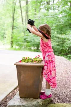 Girl with Camera Finding a Creative Perspective Stock Photos