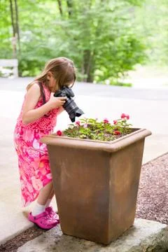 Girl with Camera Finding a Creative Perspective Stock Photos