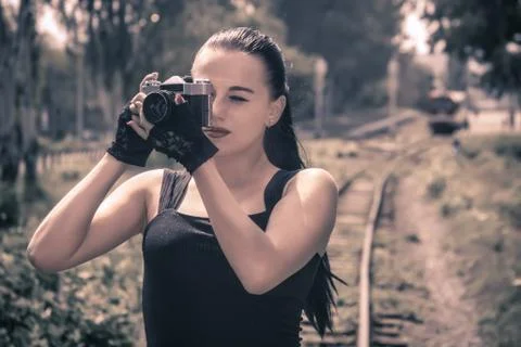 Girl with a camera Stock Photos