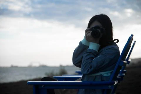 Girl with camera Stock Photos
