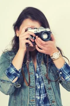 Girl with camera Stock Photos