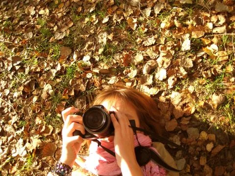 Girl with a camera Stock Photos