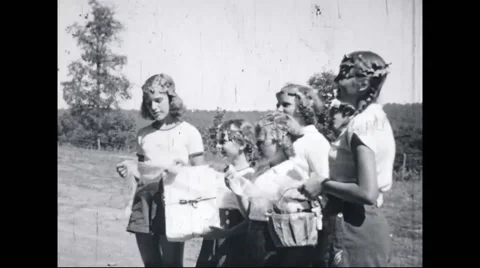 Girl campers at campsite Stock Footage