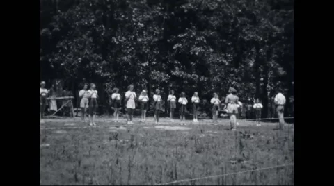 Girl campers exercising at campsite Stock Footage