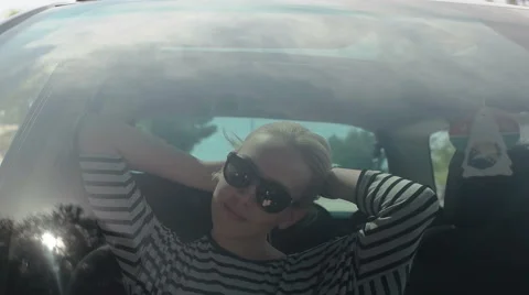 Girl in the car with reflection of the sun Stock Footage 50991508