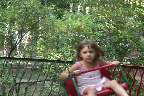 Girl on carousel  Stock Footage 1077122