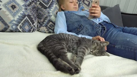 Girl with a cat Stock Footage 238775788