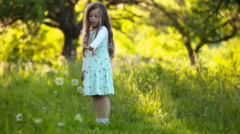 Girl catching bubbles Stock Footage 63750713